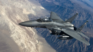 Fighter jet flying mountain range 4 - over a mountain range in the sky free wallpaper