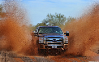 Truck driving dirt field dirt - a dirt field free wallpaper