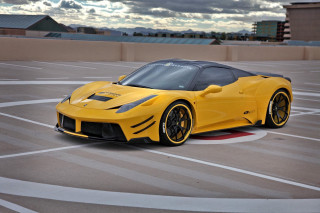 Yellow sports car parking lot 21 - a cloudy sky in the background free wallpaper