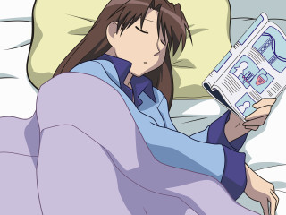 Woman reading book bed pillow - a pillow free wallpaper
