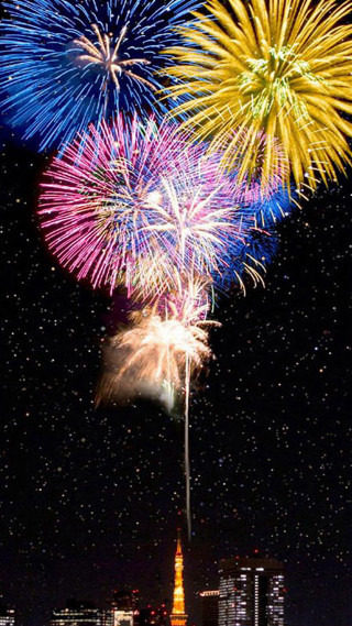Fireworks city stars clouds night - free new year wallpaper