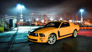 Yellow mustang car night parking - the building free wallpaper for desktop