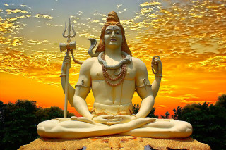 Statue man sword staff lotus - a statue of a man free wallpaper