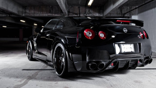 Black sports car parking garage 12 - the rear end of the car free wallpaper