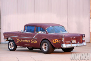 Red car parked building sign - dee whitcomb free wallpaper