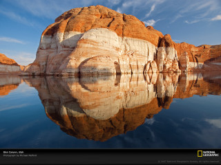 Rock formation water sky clouds - a rock formation free wallpaper