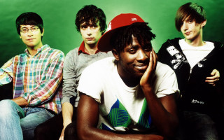 Young men green background group - a green background behind them free wallpaper