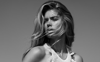 Woman blowing hair blackwhite fashion - a white background behind her free wallpaper