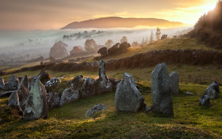 Grassy field rocks hill fog - a grassy field free wallpaper
