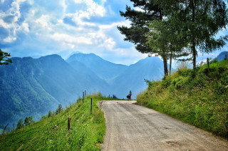 Mountain dirt road motorcycle valley - a person riding free wallpaper