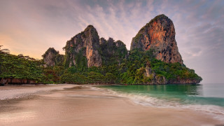 Beach mountain water wave landscape - a mountain in the background and a body of water free wallpaper