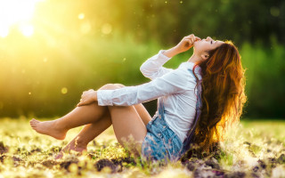 Woman sitting in grass sunlight - sunlight free wallpaper