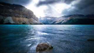 Large rock lake clouds mountains - a large rock free wallpaper