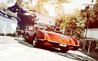 Red sports car city street 6 - f 8 aperture free wallpaper