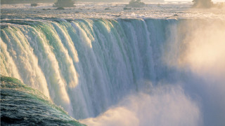 Waterfall boat mountain sunset sky 2 - side and a boat free wallpaper