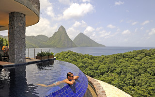 Man swimming mountains cityscape beach - unreal free wallpaper