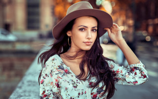 Woman hat floral shirt blood - a building in the background free wallpaper