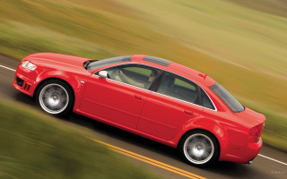 Red car driving road grass - a road next free wallpaper