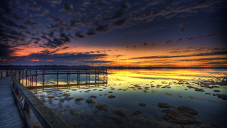 Pier sunset clouds water rocks - rock free wallpaper
