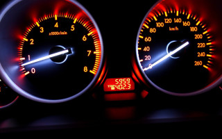 Speedometer closeup red white lights - motion blur free wallpaper for desktop