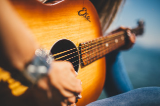 Guitar player beach ocean sunset - a person playing free wallpaper