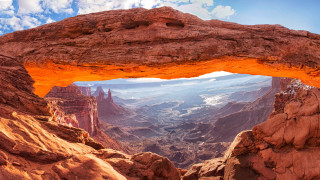 Large rock arch mountain range - a mountain range in the background free wallpaper