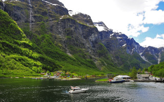 Mountain village boat river sky - the water near a mountain range free wallpaper