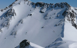 Snowy mountain ski lift skier - ski free wallpaper