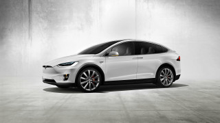 White tesla electric car concrete - a spotlight free wallpaper