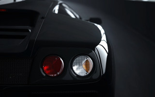 Black sports car lit up - f 8 aperture free wallpaper