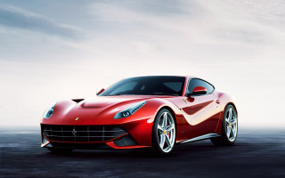 Red sports car concrete cloudy - a cloudy sky in the background free wallpaper