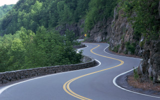 Curved road yellow line mountain - road free wallpaper
