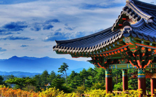 Tall building blue roof mountain 2 - a tall building free wallpaper