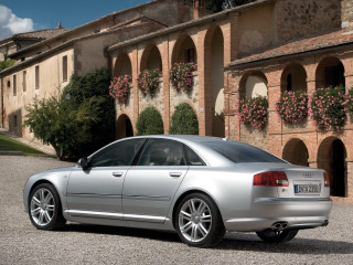 Silver car building flowers brick - a silver car free wallpaper