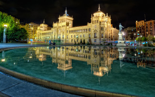 Neoclassical clocktower night cityscape reflection - a fountain in front free wallpaper