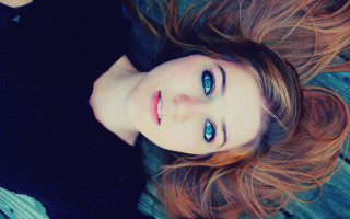 Woman longhair lying floor wideeyes - looking free wallpaper