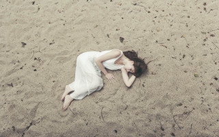 Woman sand laying blood beach - brooke shaden free wallpaper