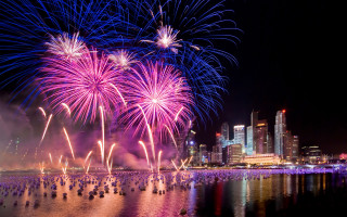 Fireworks cityscape reflection night sky - free new year wallpaper