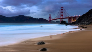 Bridge rocks beach sky mountains - a matte painting free wallpaper for desktop