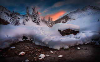 Snowy mountain sunset rocks cloudy - covered free wallpaper