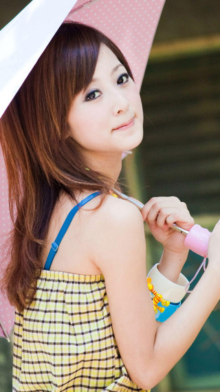 Woman holding umbrella smiling outside - the rain free wallpaper