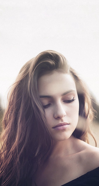 Woman longhair cellphone field portrait - head and shoulders portrait free wallpaper