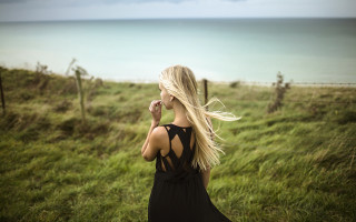 Woman blonde dress ocean field - constance copeman free wallpaper