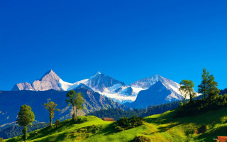 Green hills mountains clouds castle - a mountain range in the background free wallpaper