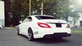 White mercedes benz coupe parking - a house and trees free wallpaper