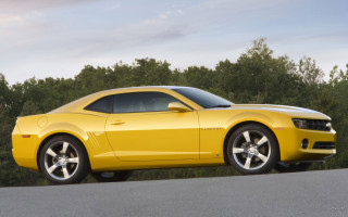 Yellow sports car nature road - a yellow sports car free wallpaper