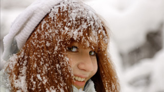Woman snowy woods portrait brown - head and shoulders portrait free wallpaper