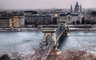 Danube bridge city skyline train - a city in the background and a bridge in the foreground free wallpaper