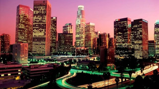 City skyline night tall buildings 21 - a street light in the foreground free wallpaper