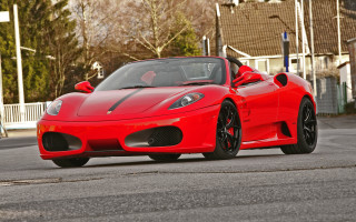 Red sports car driving street 4 - a house and trees free wallpaper